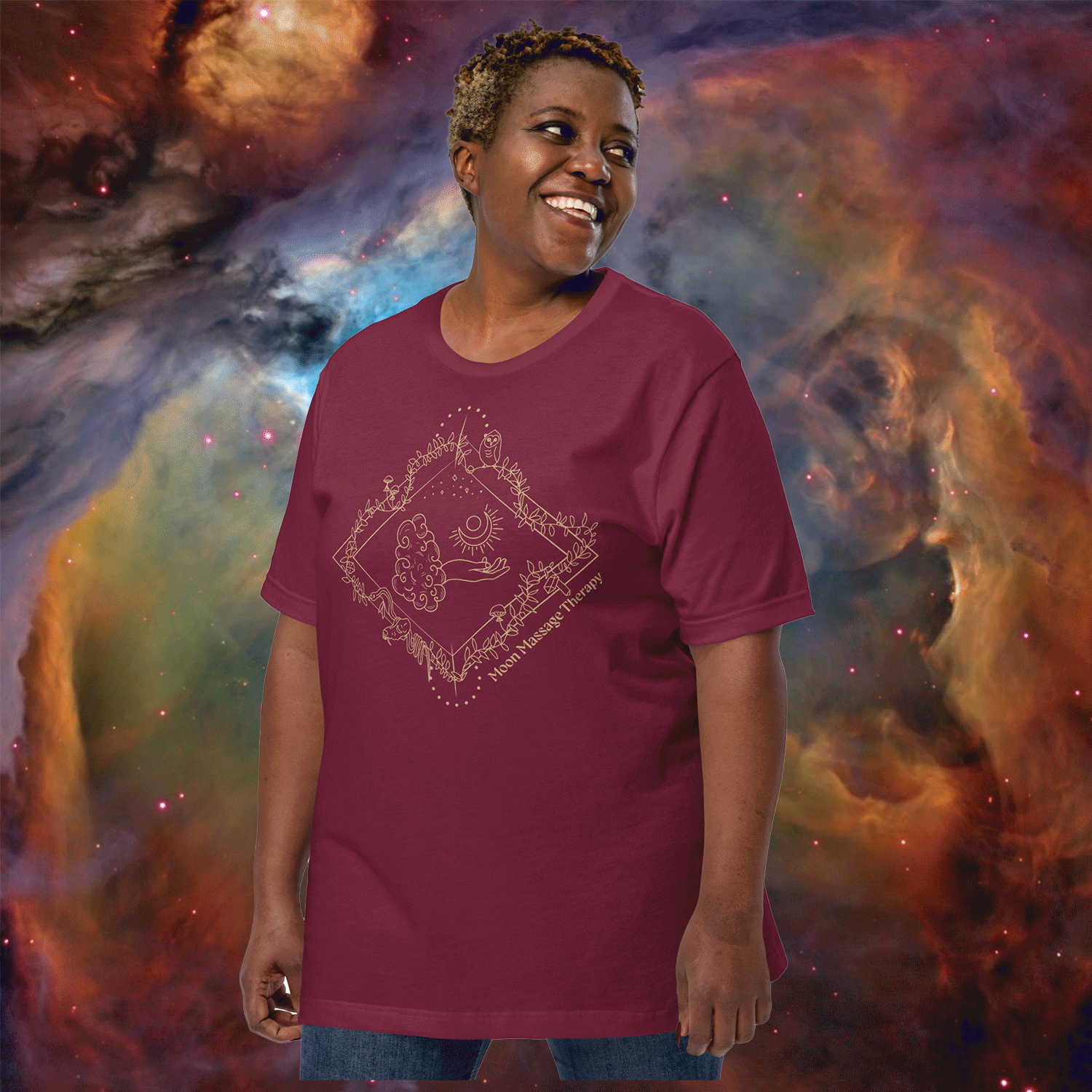 Cosmic stardust nebula-like background in various could with a gender neutral POC modeling a Moon Massage Therapy Tshirt with a magical hand emerging from a cloud, and in the hand's palm is a crescent moon. The GIF rotates through the Tshirt in burgundy, purple, white, beige, black, green, blue, and citron.